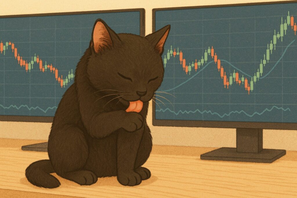 毛づくろいをする黒猫の画像です